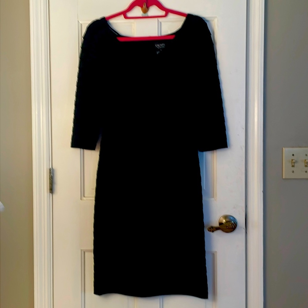 Black dress with 3/4 length sleeves and pleats